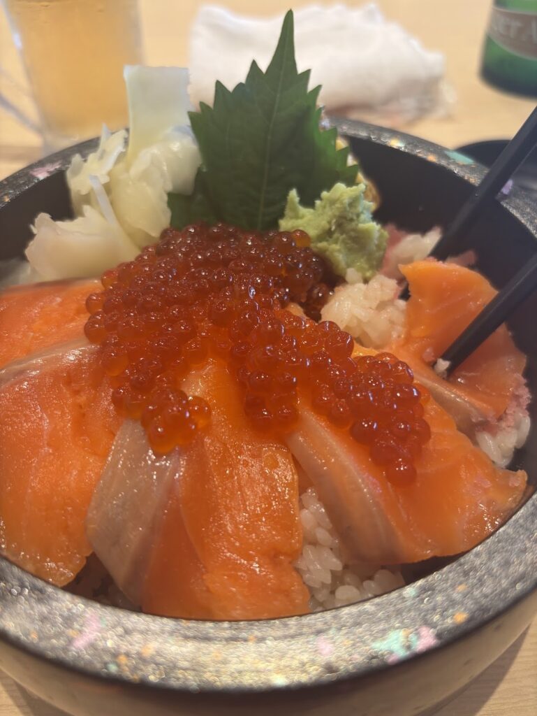 Plate of sushi: Salmon, roe, and rice. Very tasty!